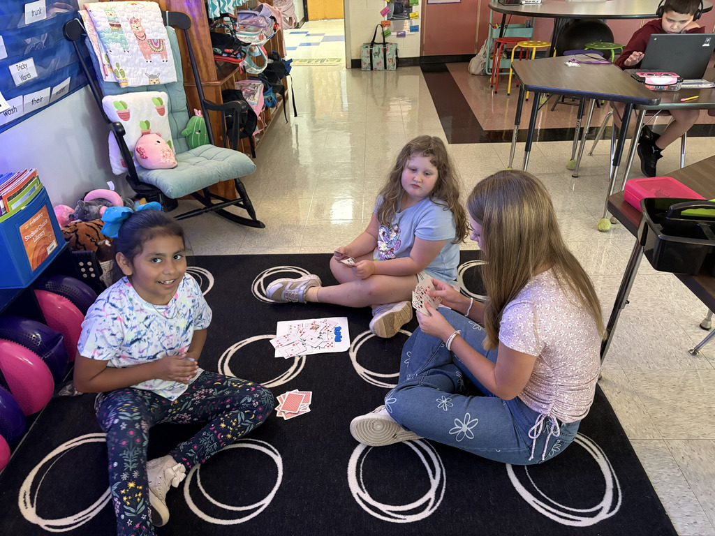 Mrs. Travis' students play bingo to practice adding three numbers.  