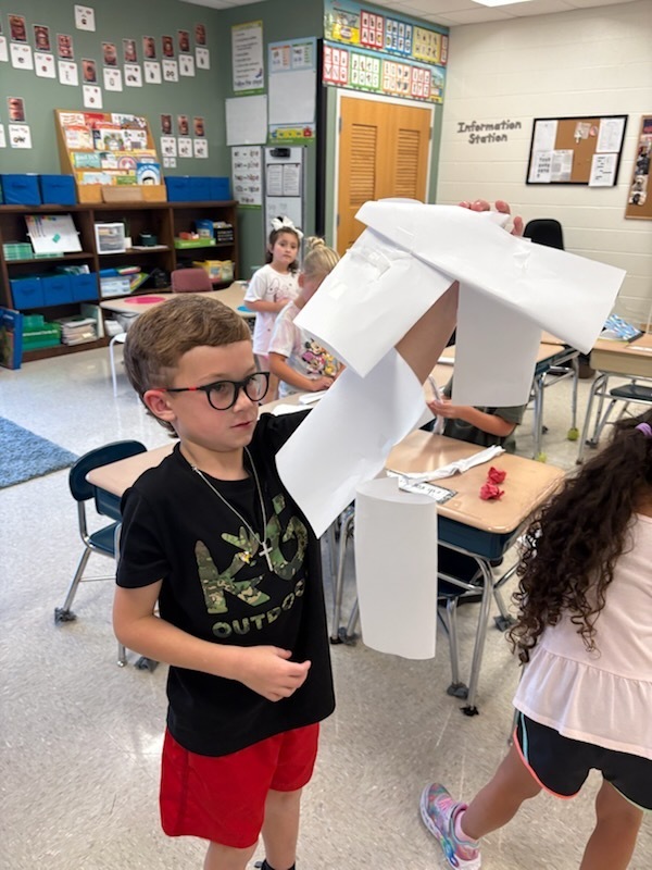 Mrs. Wray's 1st graders build apple pickers during science.  