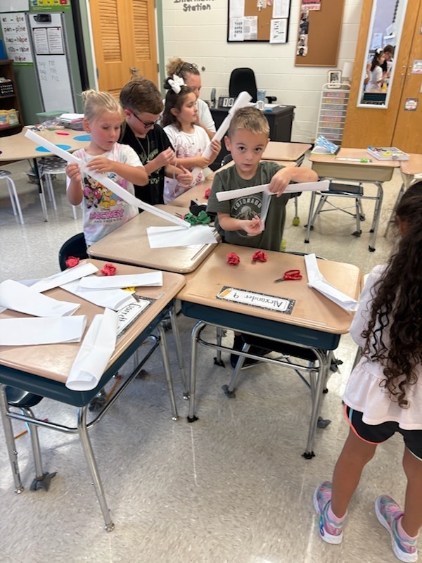 Mrs. Wray's 1st graders build apple pickers during science.  