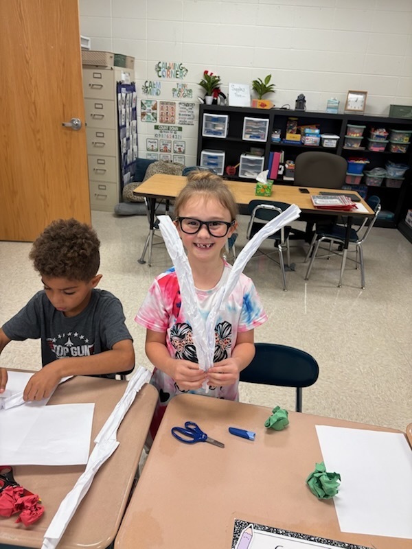 Mrs. Wray's 1st graders build apple pickers during science.  