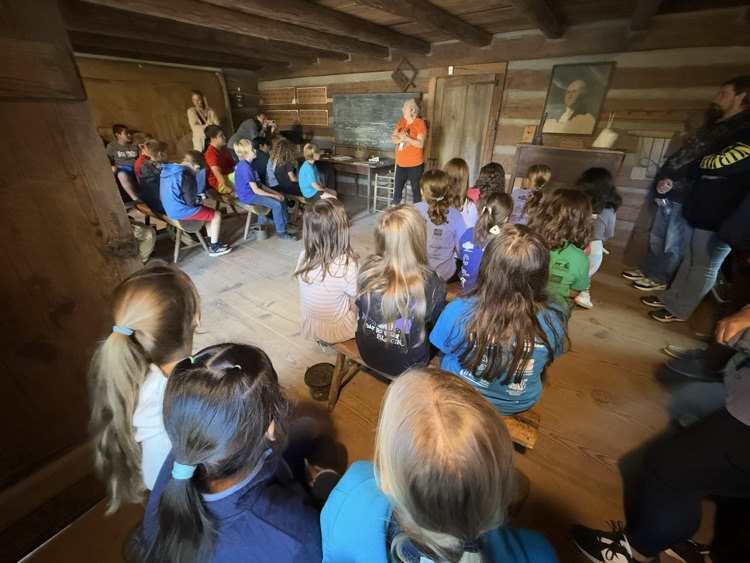 Students learn about early schools.
