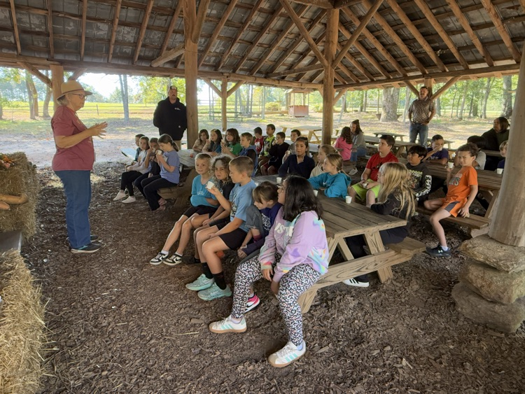 Students learn about cider making at Hart Square.
