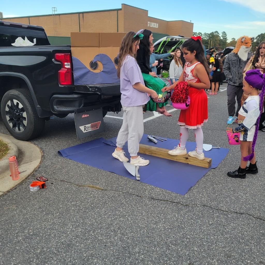 A trick or treater walking the plank to get some candy.