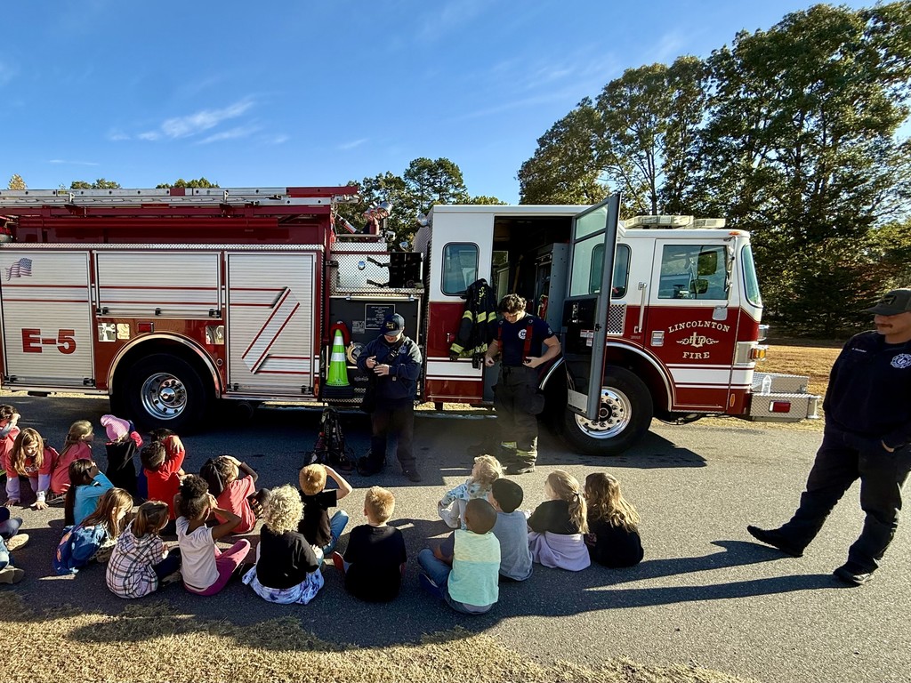 Mrs. Smith's class learns from our firefighter visitors.
