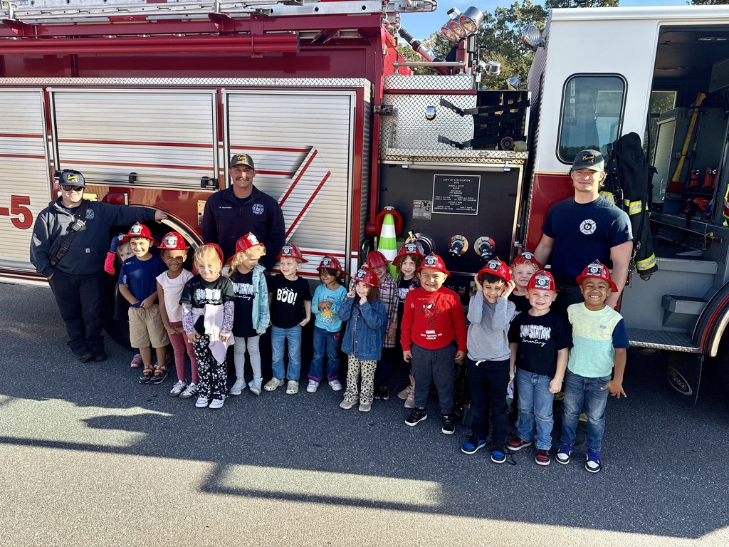 Mrs. Smith's class learns from our firefighter visitors.