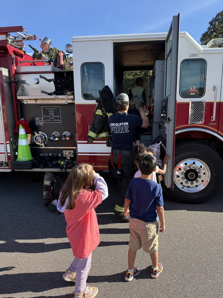 Mrs. Smith's class learns from our firefighter visitors.