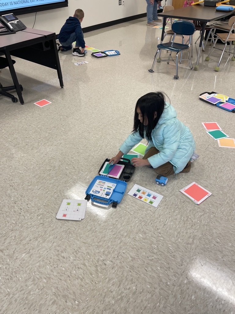 First grade students working on a STEM activity.