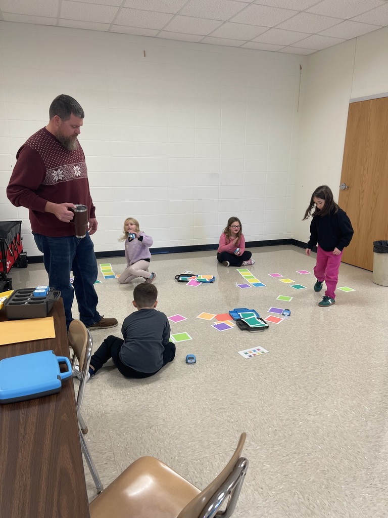 First grade students working on a STEM activity.