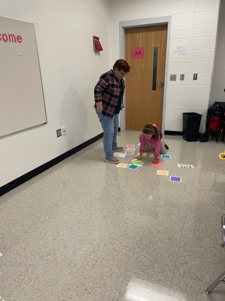 First grade students working on a STEM activity.