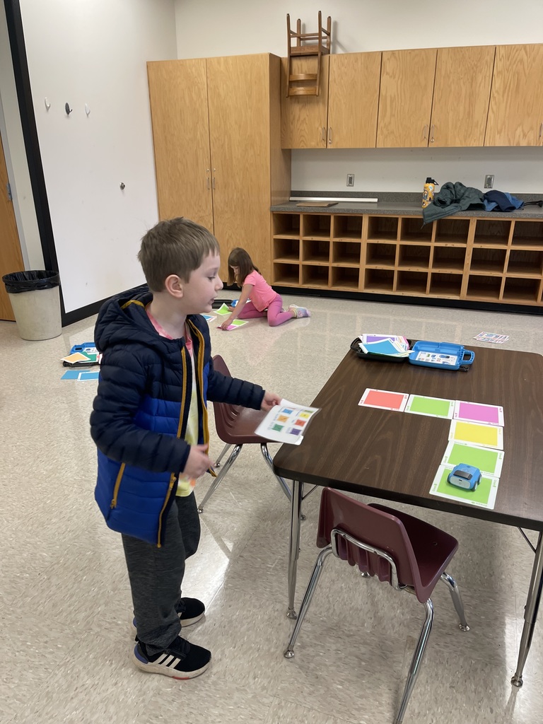 First grade students working on a STEM activity.