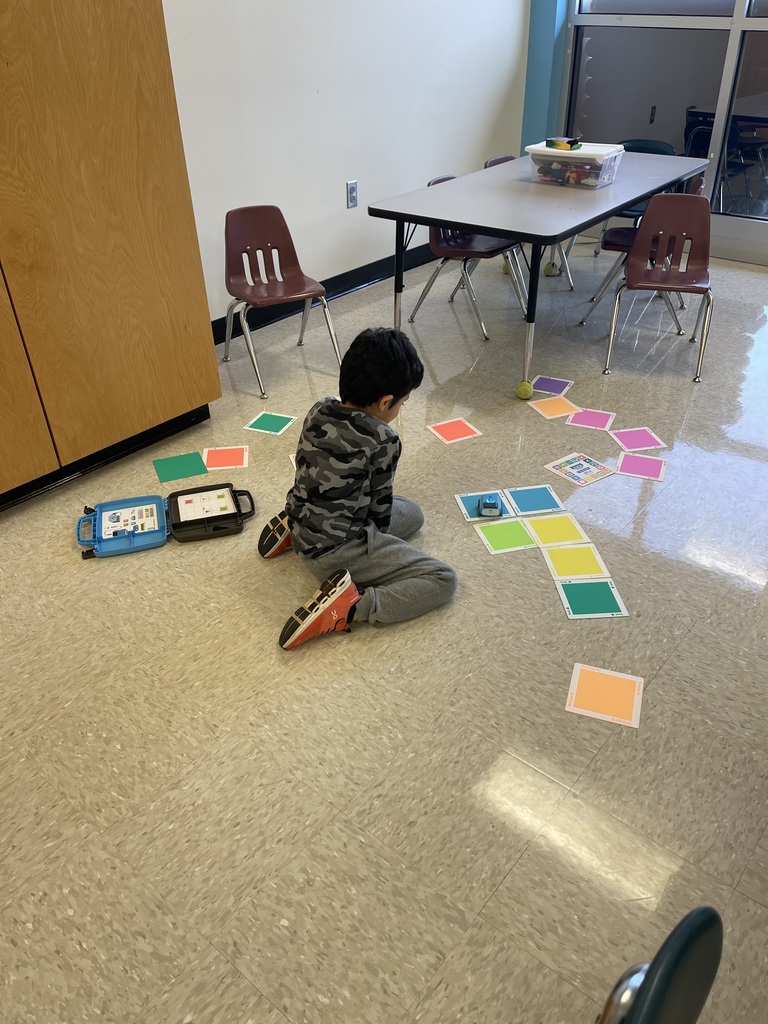 First grade students working on a STEM activity.