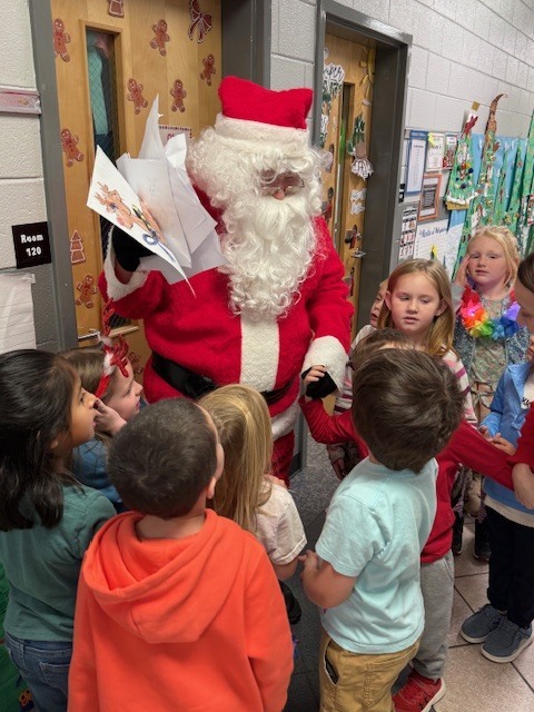 Kindergarteners were excited and surprised to see Santa.