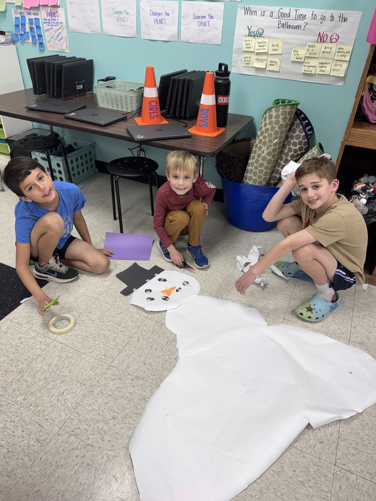 Mrs. Nordmark's students work in groups to build the biggest snowman.