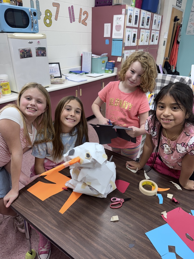 Mrs. Nordmark's students work in groups to build the biggest snowman.