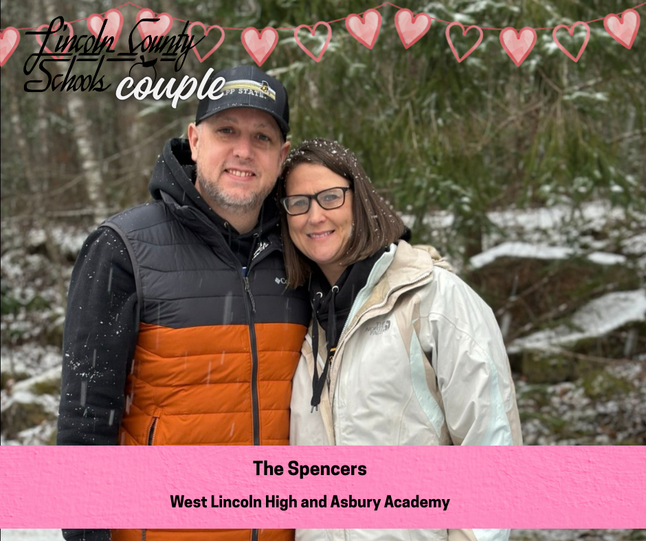 Photo of a couple standing close together outdoors in a wooded area with light snow falling. Both are wearing winter jackets, and trees with snow are visible in the background. A banner of pink hearts across the top reads “Lincoln County Schools couple.” A pink label at the bottom reads, “The Spencers – West Lincoln High and Asbury Academy.”