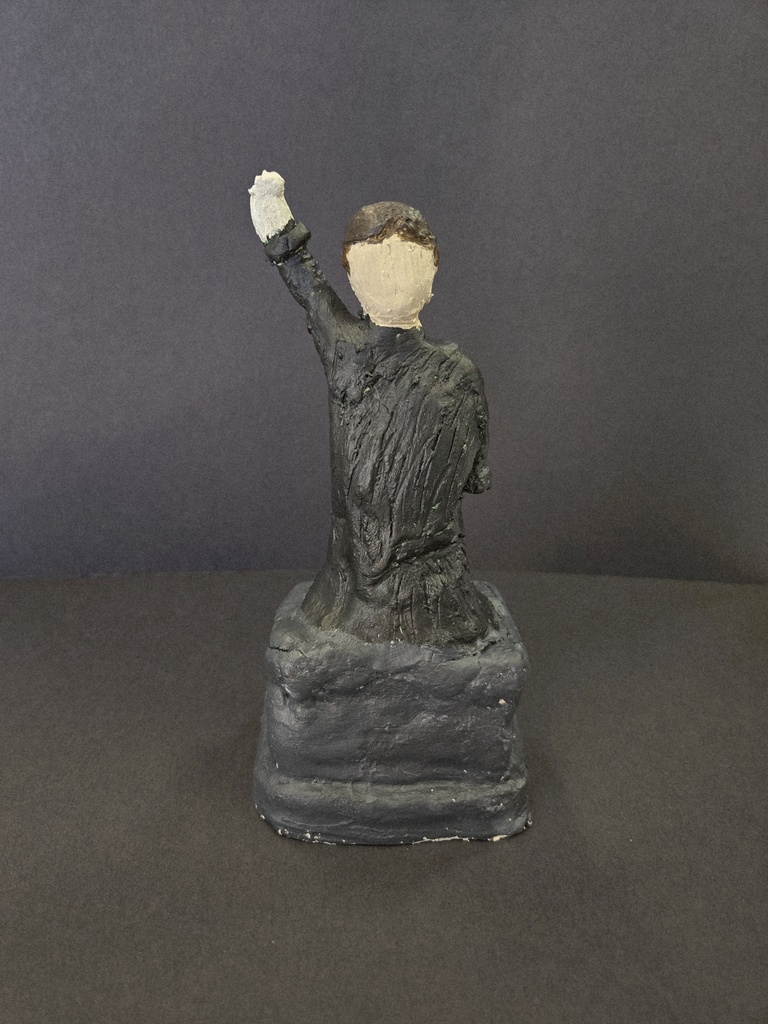 Sculpture of the Statue of Liberty dressed in black. 