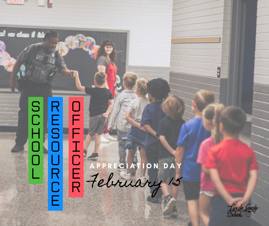An elementary school resource officer gives a fist bump to a young student in a school hallway while a line of children waits to walk past. A teacher stands nearby smiling as students move down the hallway. Vertical text on the left side reads “School Resource Officer,” and text at the bottom reads “Appreciation Day February 15.” The Lincoln County Schools logo appears in the lower right corner.