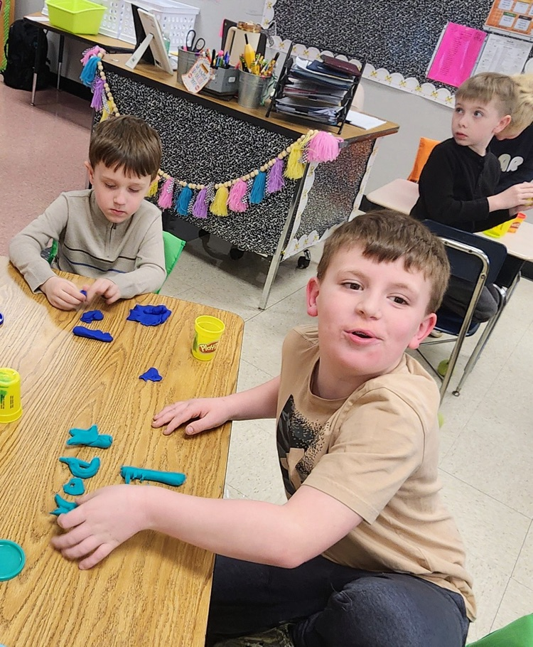 Mrs. Hoyle's class and Mrs. Fernetti's class came together to read together and complete playdough challenges
