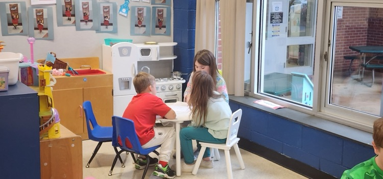 Mrs. Hoyle's class and Mrs. Fernetti's class came together to read together and complete playdough challenges