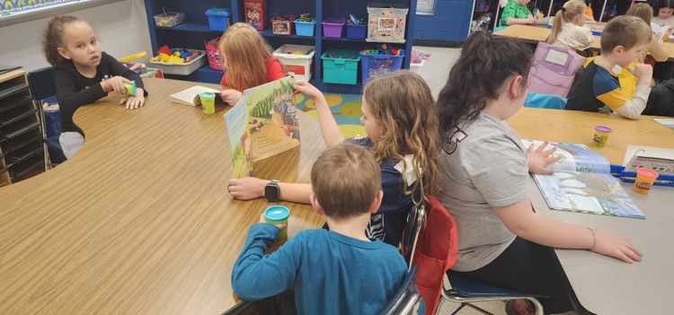 Mrs. Hoyle's class and Mrs. Fernetti's class came together to read together and complete playdough challenges