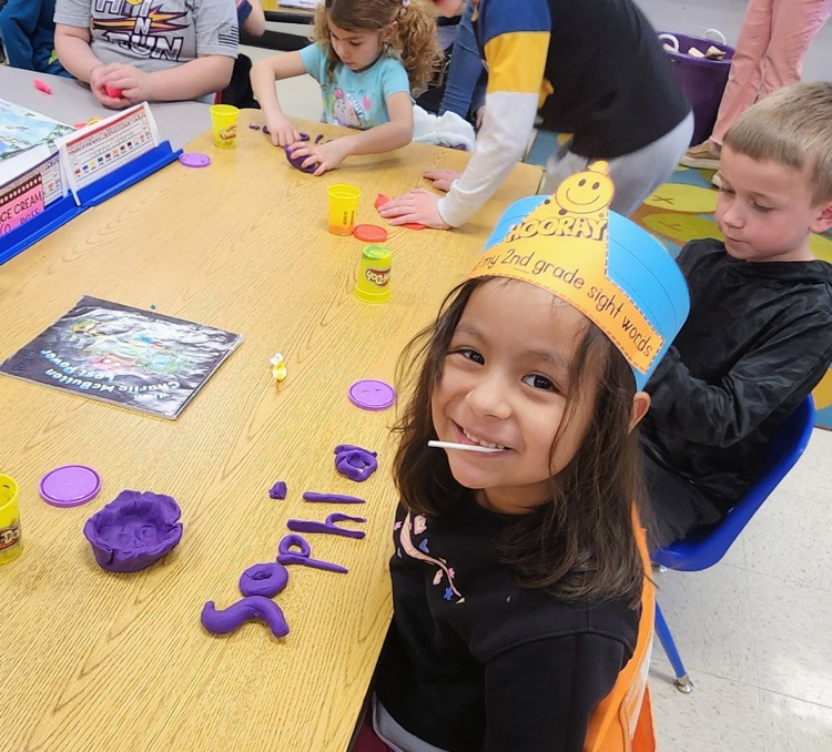 Mrs. Hoyle's class and Mrs. Fernetti's class came together to read together and complete playdough challenges