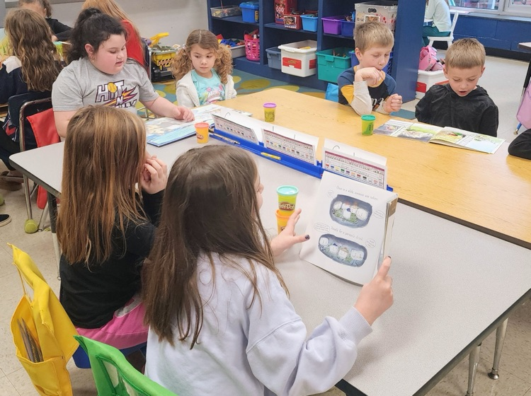 Mrs. Hoyle's class and Mrs. Fernetti's class came together to read together and complete playdough challenges