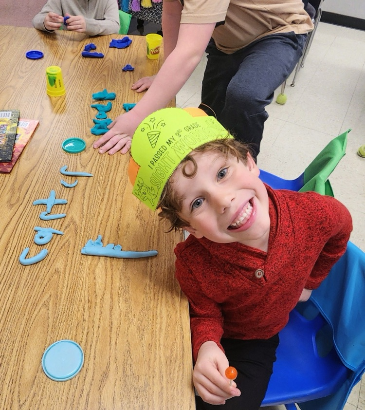 Mrs. Hoyle's class and Mrs. Fernetti's class came together to read together and complete playdough challenges
