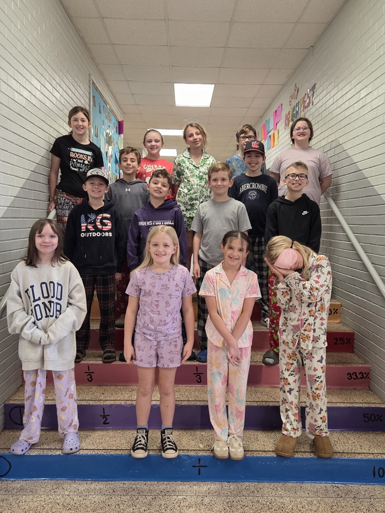 student reading books in pajamas