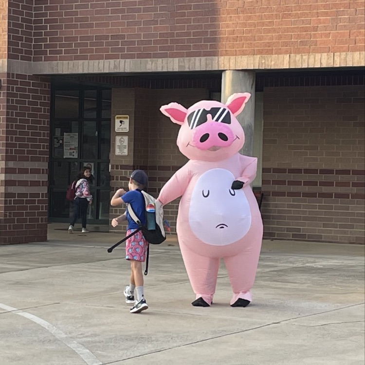 Dr. Allen, Superintendent of Lincoln County Schools, high fives a student as he enters Rock Springs  