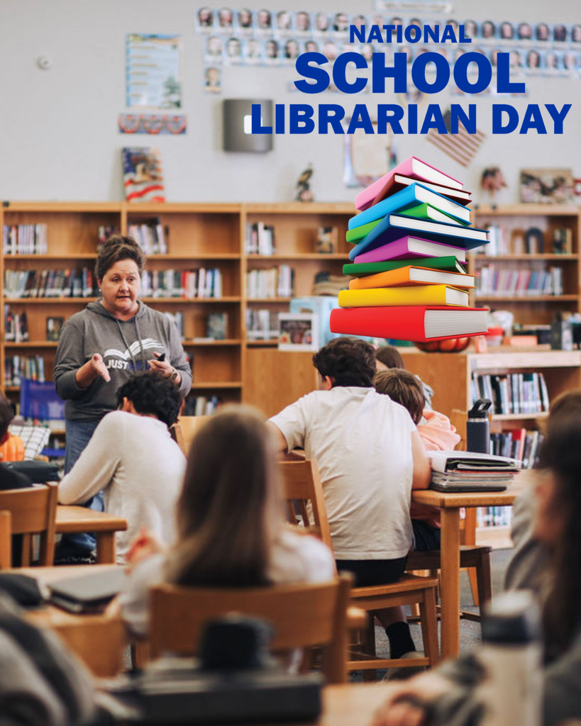 A school librarian stands at the front of a library speaking to a group of students seated at wooden tables. Bookshelves filled with books line the background. Blue text at the top reads “NATIONAL SCHOOL LIBRARIAN DAY,” and a colorful stack of books graphic appears to the right.