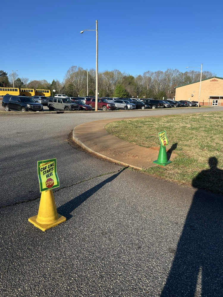 Car Rider Line Starts Here Sign, please stop at the end of the sidewalk today. 