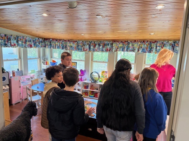 students touring the play room