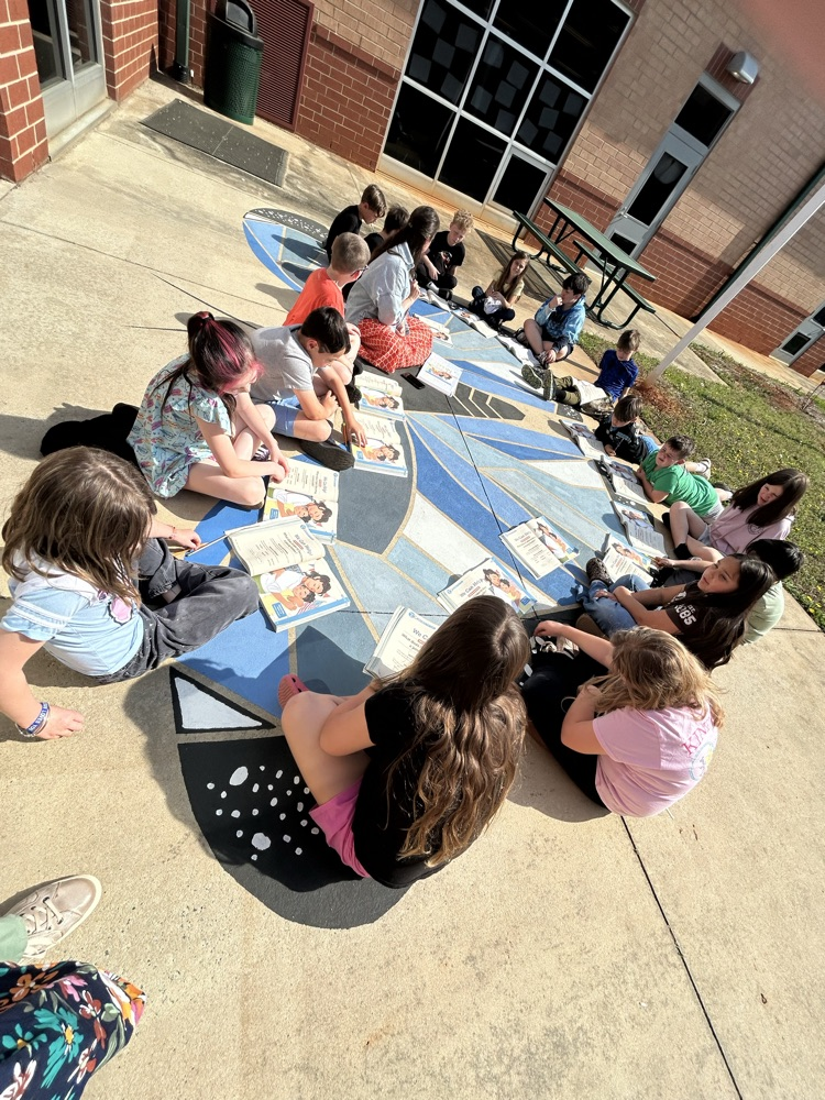 Students reading outside
