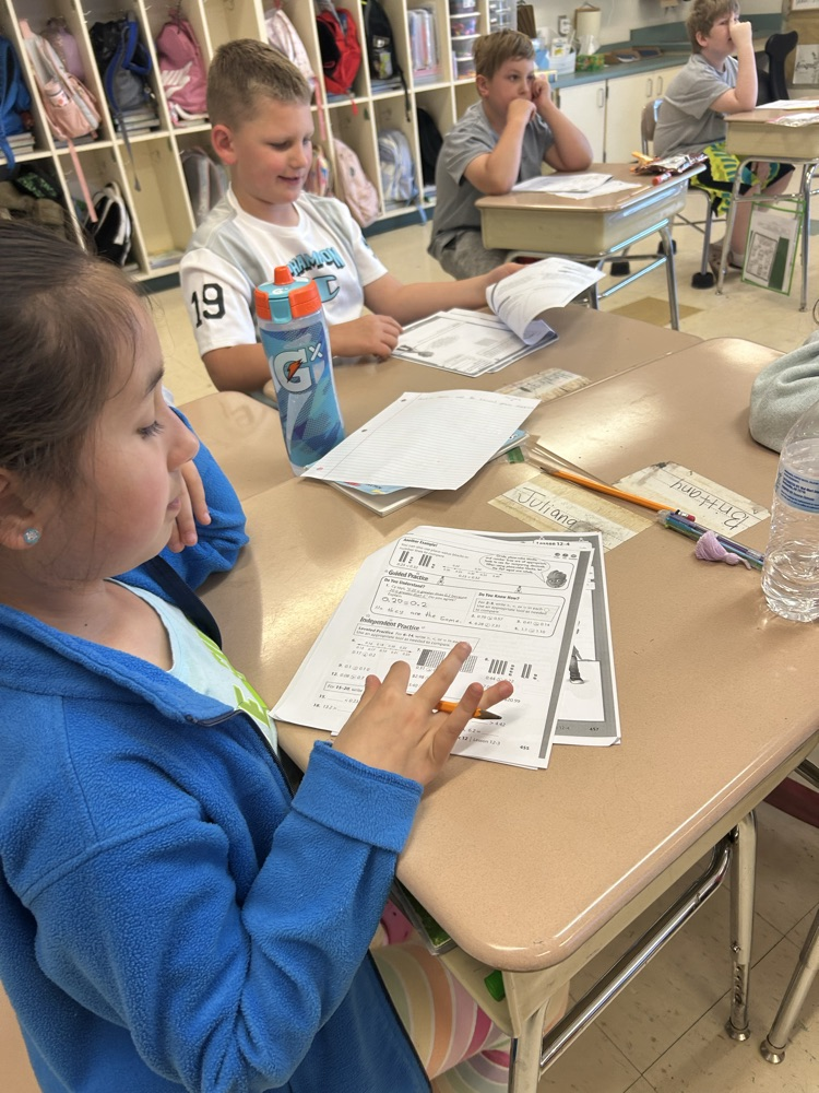 students using models to create fractions