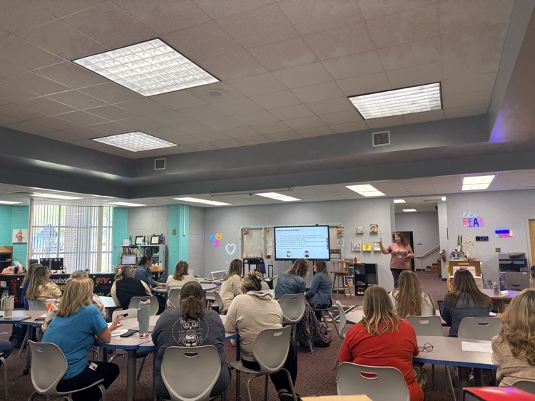 union staff  meeting included teachers working in on professional games and learning academic benefits of engaging games