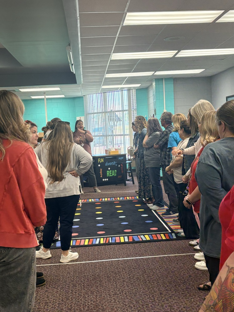 union staff  meeting included teachers working in on professional games and learning academic benefits of engaging games