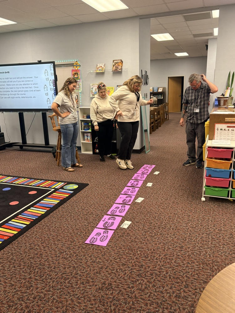 union staff  meeting included teachers working in on professional games and learning academic benefits of engaging games