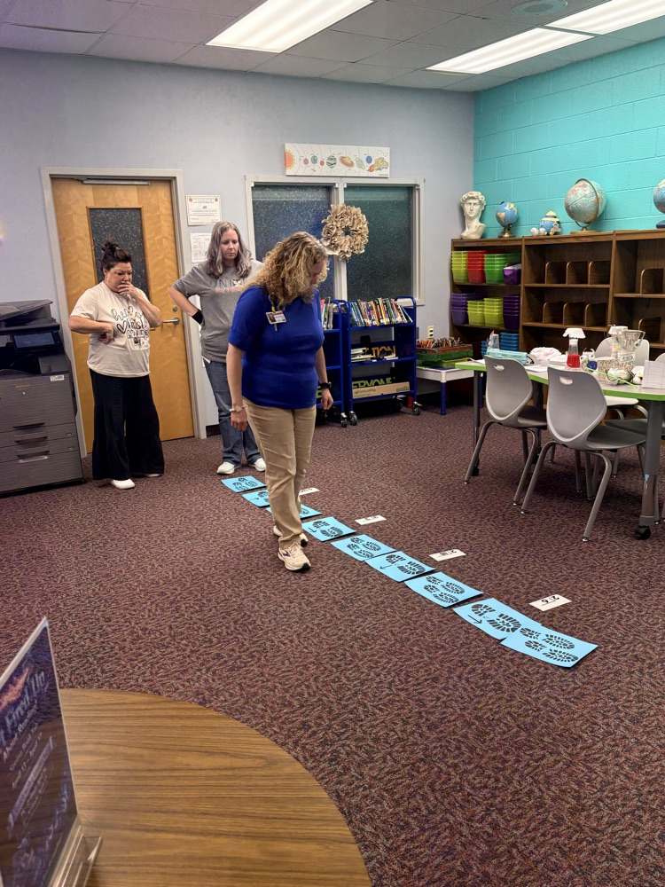 union staff  meeting included teachers working in on professional games and learning academic benefits of engaging games