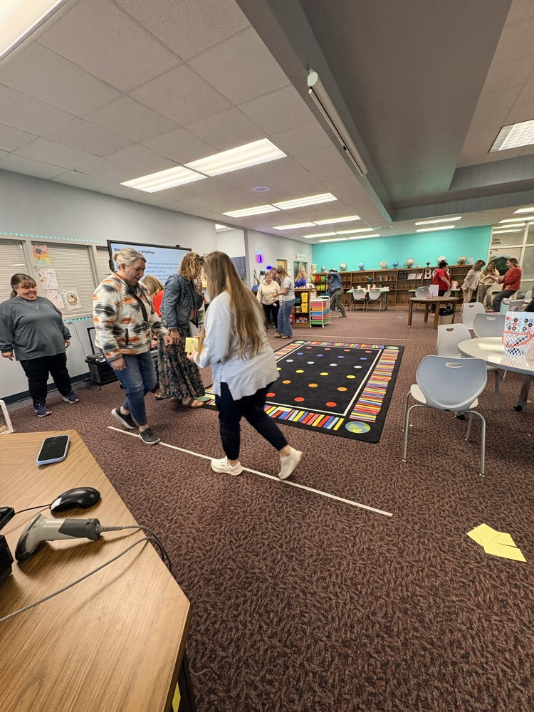 union staff  meeting included teachers working in on professional games and learning academic benefits of engaging games