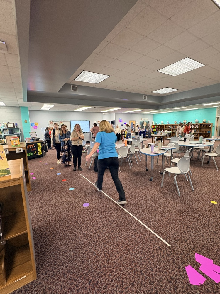 union staff  meeting included teachers working in on professional games and learning academic benefits of engaging games