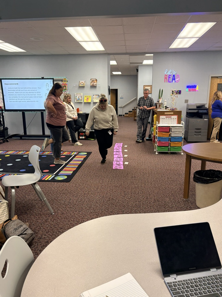 union staff  meeting included teachers working in on professional games and learning academic benefits of engaging games