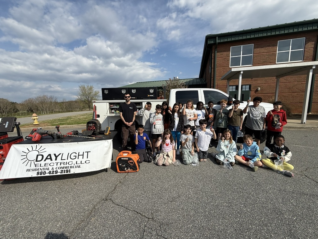 Fourth-grade students interact with local professionals and explore vehicles and equipment during Careers on Wheels events at middle schools, learning about a variety of careers in their community.