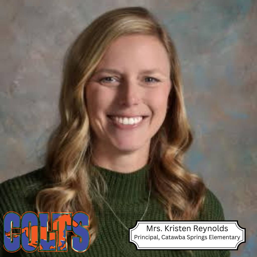 A smiling woman with blonde wavy hair wears a green sweater. She is identified as Mrs. Kristen Reynolds, Principal at Catawba Springs Elementary.