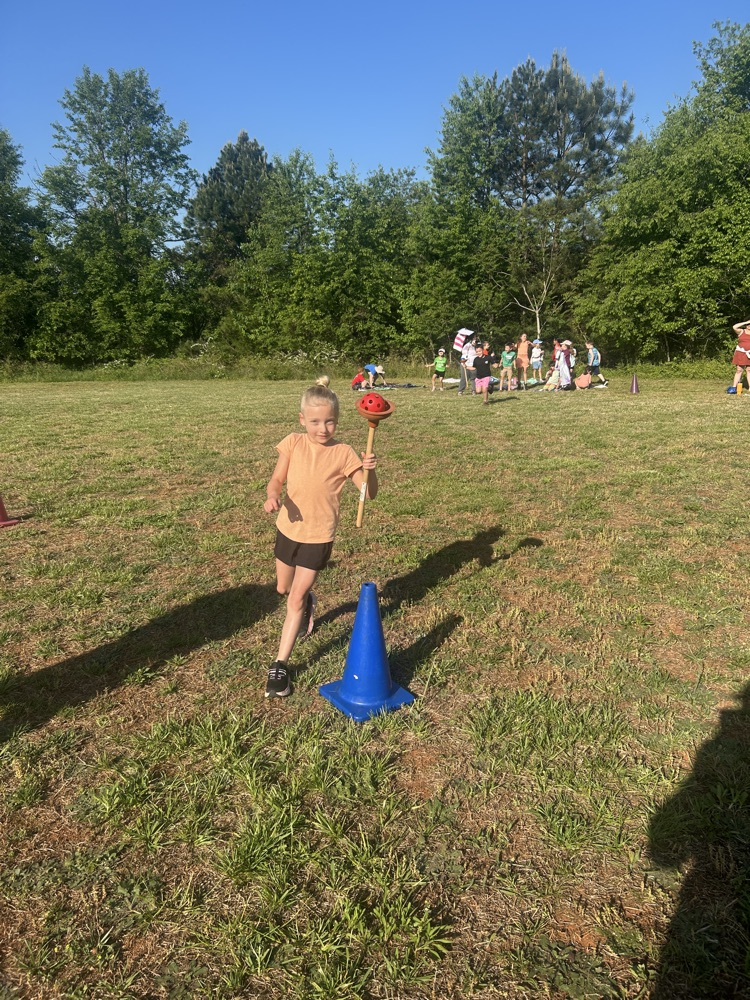 student participating in a relay race.