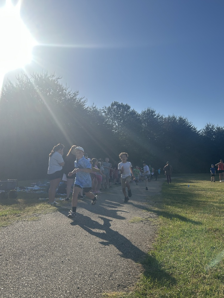 students participating in running relay.