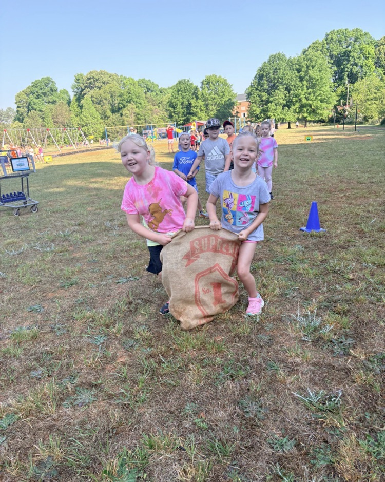 field day fun two girls in a three legged race