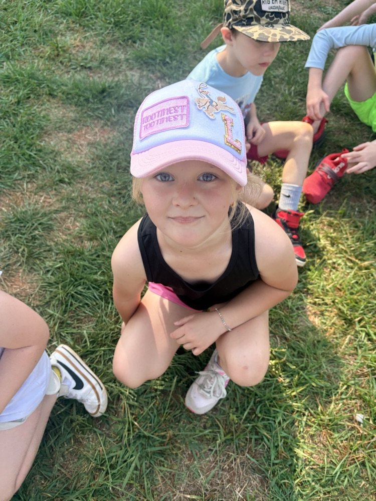 blond girl with a pink hat