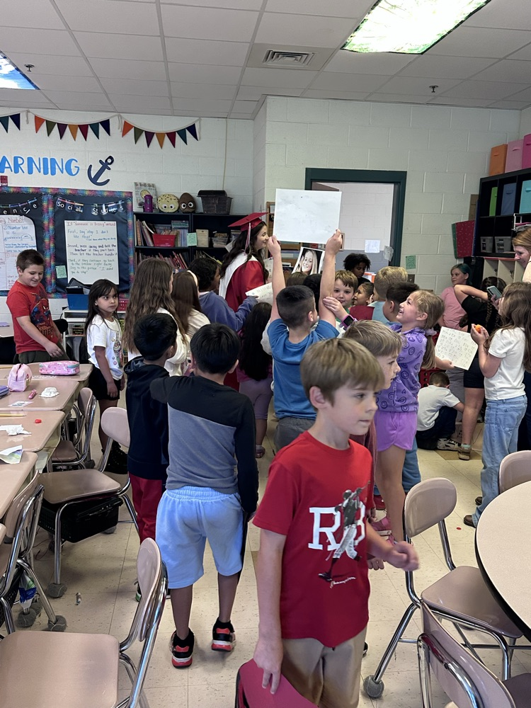 second grade students celebrating 