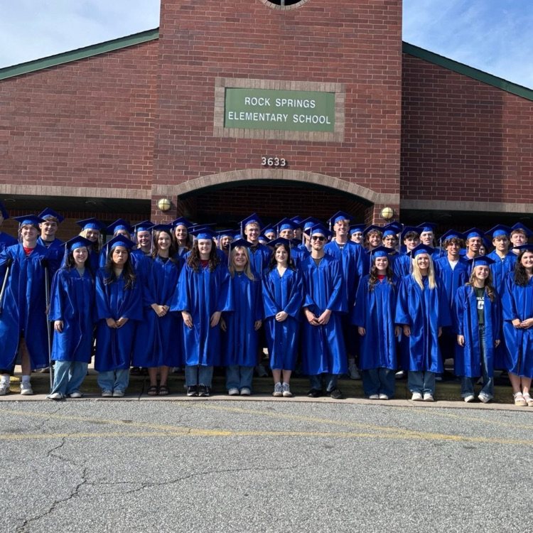 North Lincoln High School Seniors standing in front of Rock Springs Elementary School.