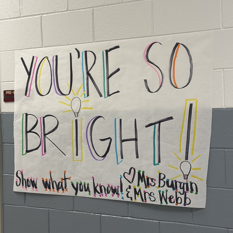 white poster saying “you are so bright show what you know love Mrs. Burgin and Mrs. Webb